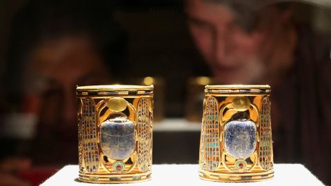 Visitors look at artefacts displayed at the Egyptian Museum as Egypt's Ministry of Tourism and Antiquities celebrates World Tourism Day, in Cairo, on Tuesday.