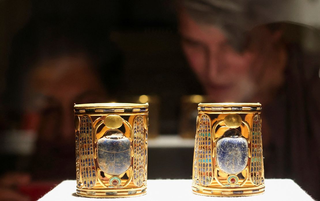 Visitors look at artefacts displayed at the Egyptian Museum as Egypt's Ministry of Tourism and Antiquities celebrates World Tourism Day, in Cairo, on Tuesday. 