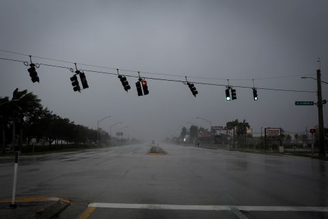Traffic lights are blown by strong gusts of wind in Fort Myers, Florida, on Wednesday.