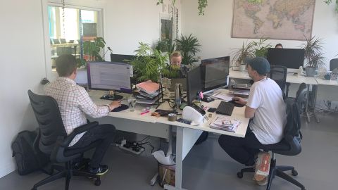Employees of 5 Squirrels, a skincare manufacturing company in southern England, during 'deep work time' in the office, where they can focus on projects without email interruptions.