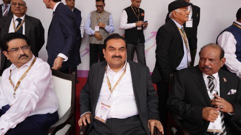 Gautam Adani, center, sits for a group photographer during a ceremony in the northern Indian state of Uttar Pradesh, India, on June 3.