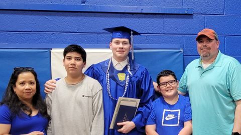 Anthony Zuccarini, far right, canceled a family vacation this summer because of high prices. But the family hopes to take one in the spring.