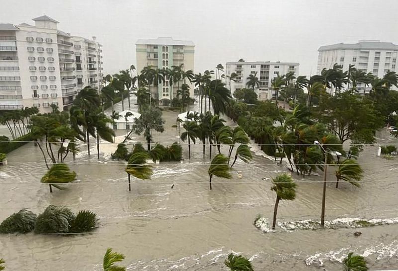 'Life-changing' Hurricane Ian batters Florida, knocking out power and trapping residents as it continues its damaging crawl through the state