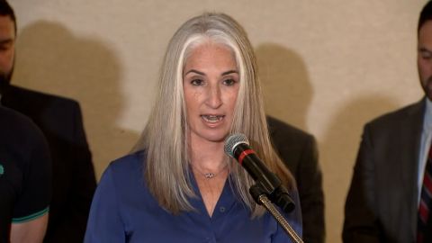 Plaintiff Lauren Bennett, who was shot twice in the July 4 parade massacre in Highland Park, speaks at a press conference in Northbrook, Ill., on Wednesday.