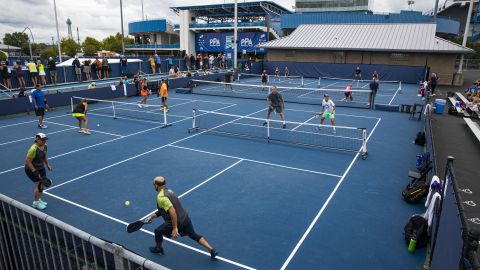 Amateur pickleball players play mixed doubles during the Professional Pickleball Association Baird Wealth Management Open.