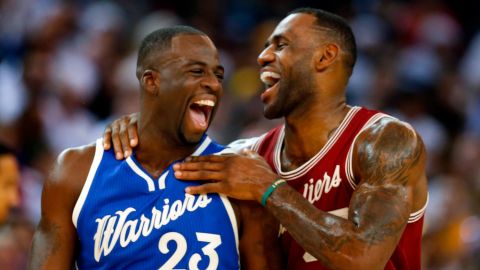 LeBron James and Draymond Green share moments from the first half of an NBA game on Christmas Day 2015 at Oracle Arena in Oakland, CA. 