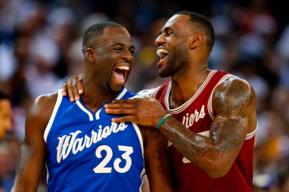 LeBron James and Draymond Green share a moment in the first half of a NBA game at Oracle Arena in Oakland, California on Christmas Day 2015. 