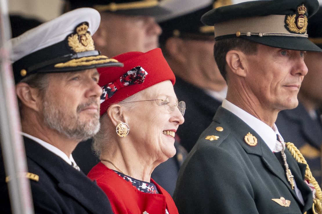 Queen Margrethe is flanked by her sons Crown Prince Frederik (L) and Prince Joachim (R) as she attends festivities in Korsoer, Denmark on August 29, to celebrate 50 years on the throne. 