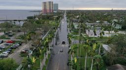 FORT MYERS FLORIDA - SEPTEMBER 29:  In this aerial view, vehicles make their way through a flooded area after Hurricane Ian passed through the area on September 29, 2022 in Fort Myers, Florida. The hurricane brought high winds, storm surge and rain to the area causing severe damage. (Photo by Joe Raedle/Getty Images)
