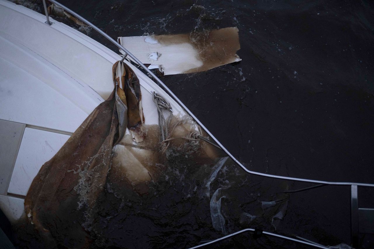 A boat lies partially submerged in Punta Gorda, Florida, on Thursday.