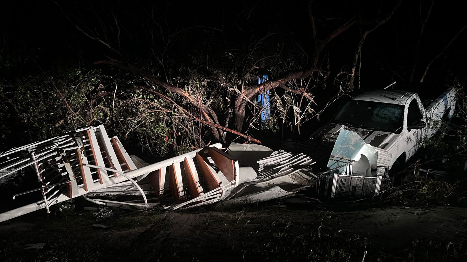 A spiral staircase lies next to a damaged pickup truck in Sanibel, Florida, on Thursday.