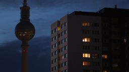 The broadcast tower at Alexanderplatz stands without illumination behind an apartment building in the city center at twilight on September 8, 2022 in Berlin, Germany. Germany, long dependent on energy imports from Russia, is facing uncertain times as it seeks to pivot away from Russian gas, oil and coal. While it is building new LNG terminals on its northern coasts and increasing natural gas imports from Norway and Holland to offset the diminished flow of Russian natural gas, at the same time the government is pursuing measures to reduce electricity consumption, including banning the illumination of public buildings, billboards and landmarks at night. Energy prices have risen enormously in Germany and across Europe this year due to the consequences of Russia's ongoing war in Ukraine, raising concerns of consumers who will face multifold increased energy bills.  