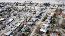 This aerial photo shows damaged homes and debris in the aftermath of Hurricane Ian, Thursday, Sept. 29, 2022, in Fort Myers, Fla. (AP Photo/Wilfredo Lee)