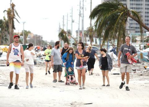 Fort Myers residents explore damage on Fort Myers Beach on Thursday.