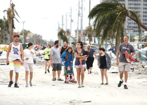 'Substantial Loss Of Life' Possible In Florida As Tropical Storm Ian Now Takes Aim At South Carolina | CNN 51 Fort Myers residents explore damage on Fort Myers Beach on Thursday.