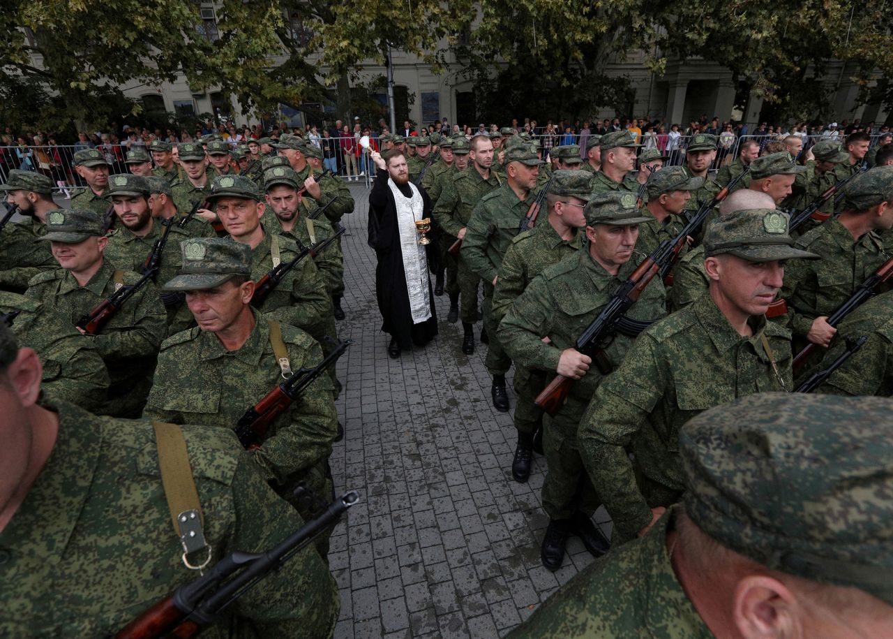 An Orthodox priest in Sevastopol, Crimea, conducts a service for reservists drafted by Russia on Tuesday, September 27. Russian President Vladimir Putin announced the <a href="https://www.cnn.com/2022/09/21/europe/ukraine-russian-referendums-intl-hnk/index.html" target="_blank">"partial mobilization"</a> of Russian citizens last week, a move that threatens to escalate his faltering invasion of Ukraine. So far, the mobilization <a href="https://www.cnn.com/2022/09/25/europe/russian-mobilization-putin-exodus-chaos-new-laws-intl-hnk" target="_blank">is off to a chaotic start</a> amid protests, drafting mistakes and people fleeing Russia.