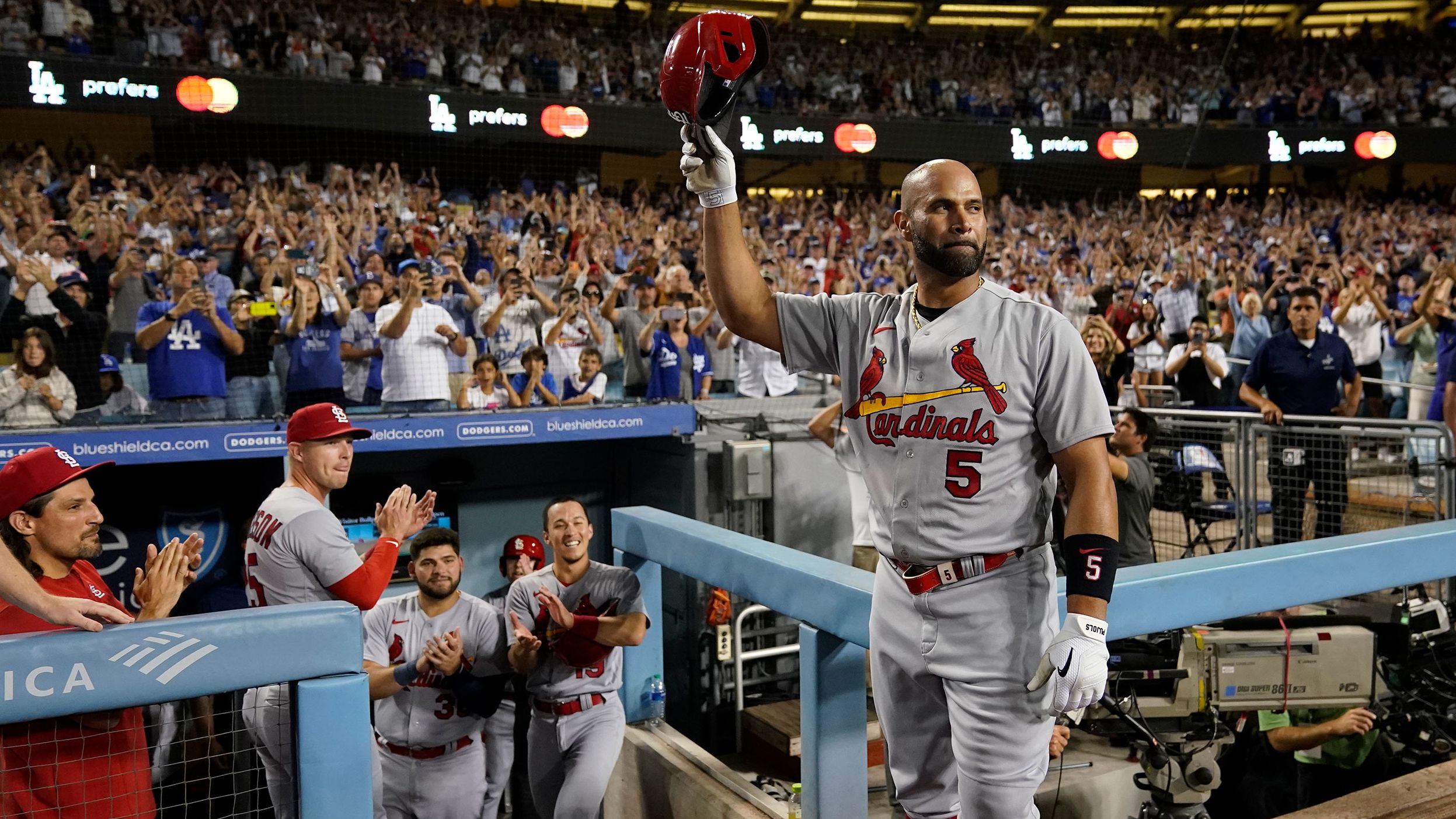 St. Louis' Albert Pujols acknowledges the crowd in Los Angeles after <a href="https://www.cnn.com/2022/09/23/sport/albert-pujols-700-career-home-runs-spt" target="_blank">hitting his 700th career home run</a> on Friday, September 23. He is only the fourth player in Major League Baseball history to hit 700 home runs, joining Barry Bonds, Hank Aaron and Babe Ruth.