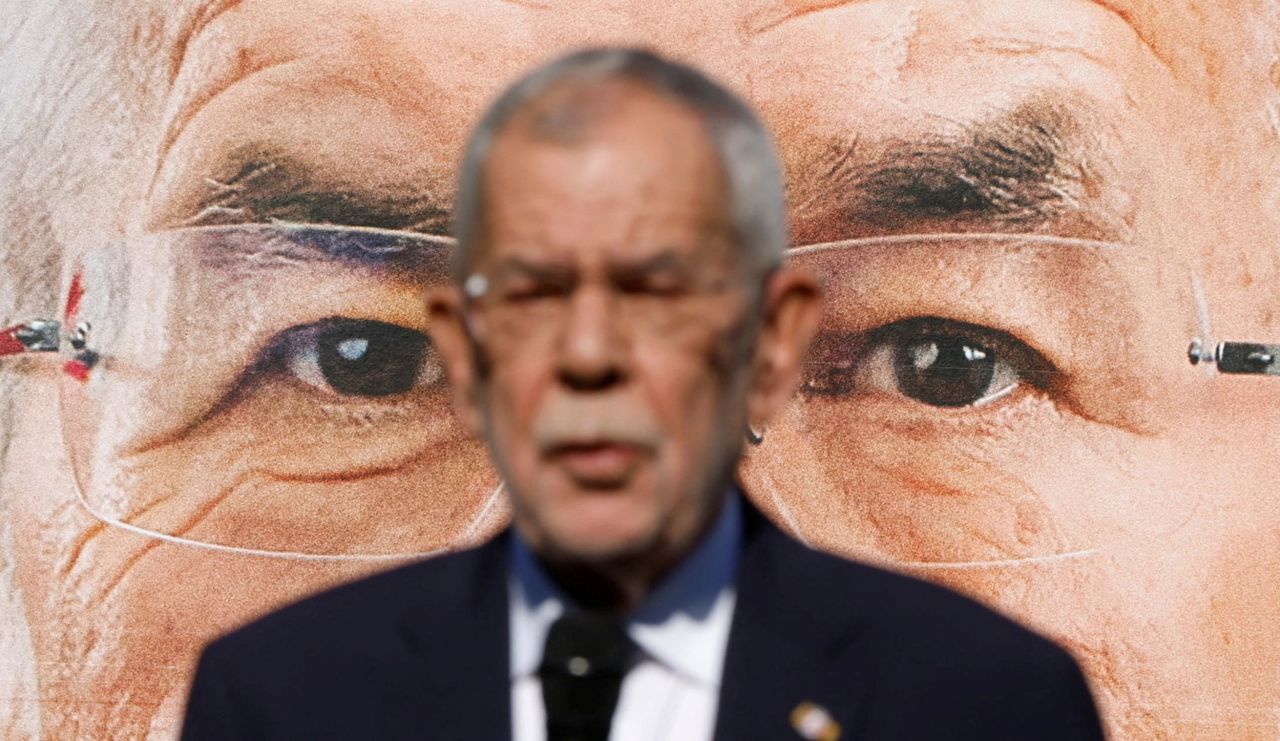 Austrian President Alexander Van der Bellen presents election campaign posters in Vienna on Friday, September 23.
