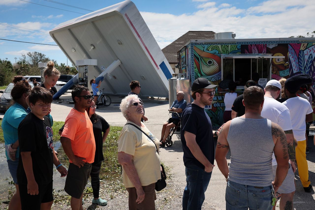 Residents of Port Charlotte, Florida, line up for free food that was being distributed from a taco truck on Thursday.