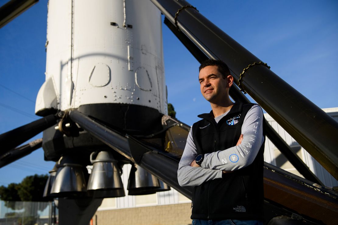 Inspiration4 mission commander Jared Isaacman, founder and chief executive officer of Shift4 Payments, stands for a portrait in front of the recovered first stage of a Falcon 9 rocket at Space Exploration Technologies Corp. (SpaceX) on February 2, 2021 in Hawthorne, California. - Isaacman's all-civilian Inspiration4 mission will raise $200 million for St. Jude Children's Research Hospital through a donation based sweepstakes to select a member of the crew. (Photo by Patrick T. FALLON / AFP) (Photo by PATRICK T. FALLON/AFP via Getty Images)
