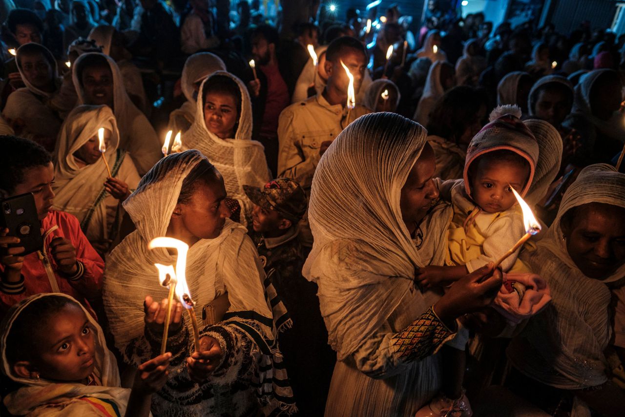 People in Addis Ababa, Ethiopia, hold candles Monday, September 26, during celebrations that were held on the eve of the Ethiopian Orthodox holiday of Meskel.