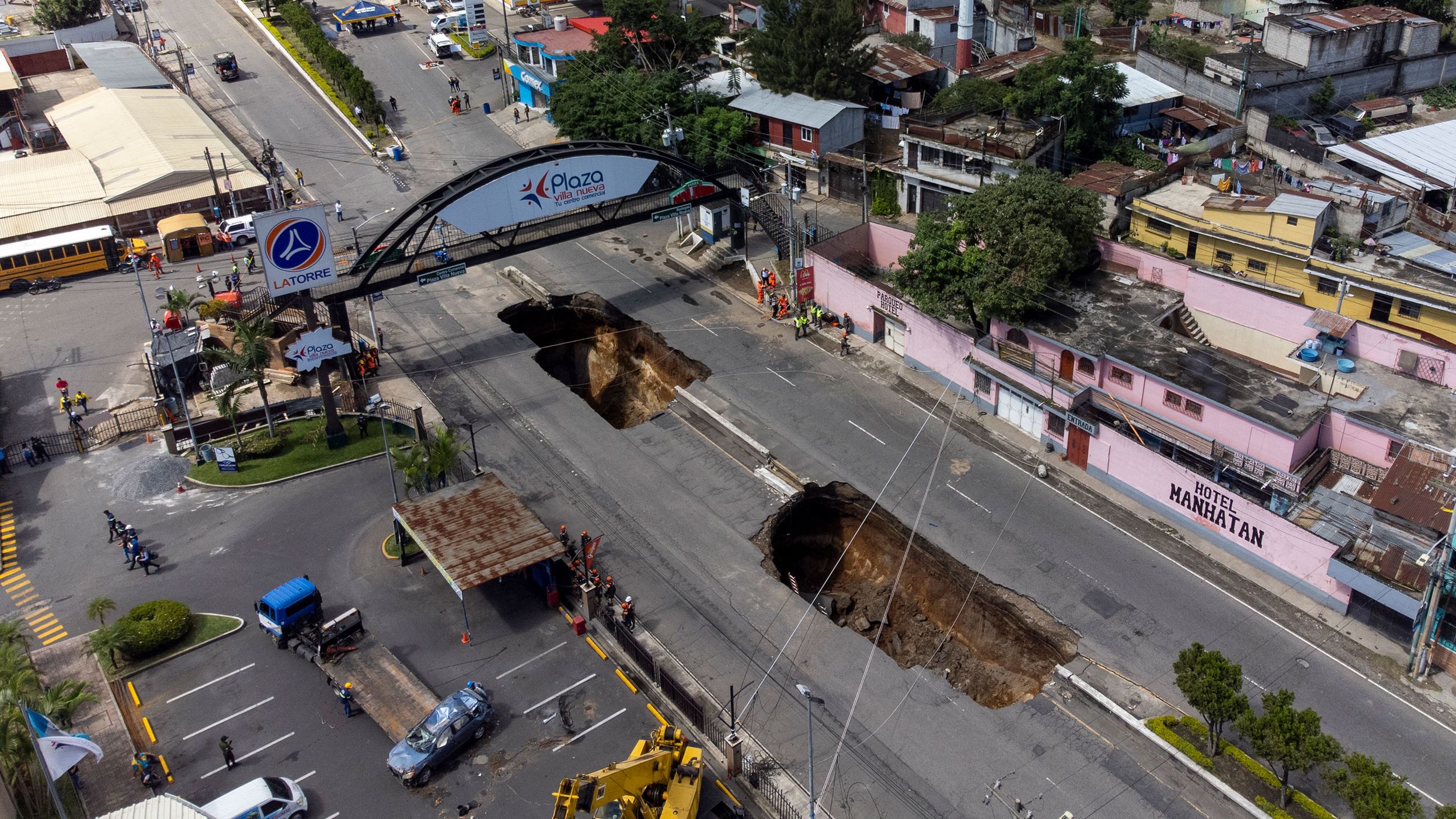 Two sinkholes are exposed on a street in Villa Nueva, Guatemala, on Sunday, September 25. Three people were injured and two were missing after <a href="https://www.cnn.com/videos/world/2022/09/26/sinkholes-guatemala-injured-missing-lon-orig-na.cnn" target="_blank">the sinkholes</a> opened up the day before, according to the Reuters news agency.