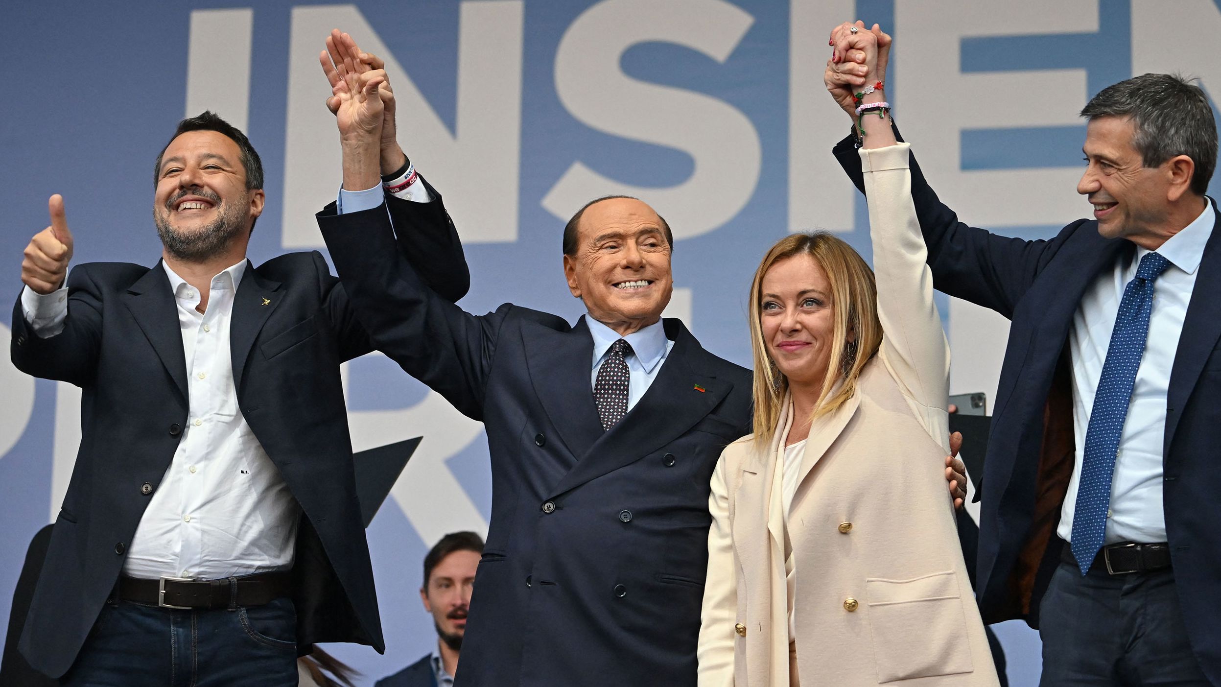 From left, Italian political leaders Matteo Salvini, Silvio Berlusconi, Giorgia Meloni and Maurizio Lupi stand on stage Thursday, September 22, during a rally of the country's coalition of right-wing political parties. Meloni later claimed victory in a general election <a href="https://www.cnn.com/2022/09/25/europe/italy-election-results-intl/index.html" target="_blank">set to install her as Italy's first female prime minister.</a>