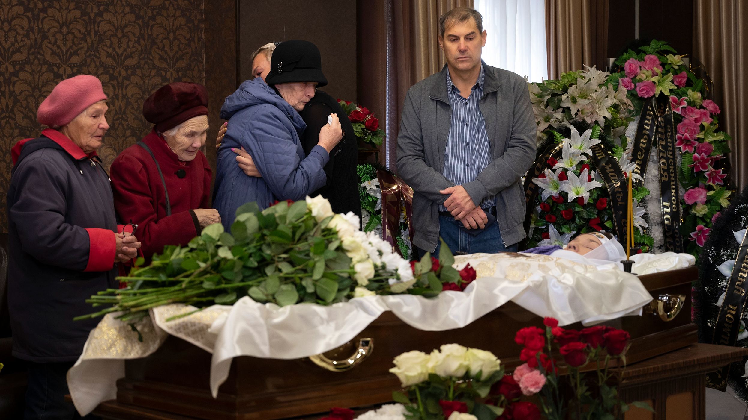 People react Wednesday, September 28, as they attend a farewell to teacher Natalya Vedernikova, one of the victims of a <a href="https://www.cnn.com/2022/09/26/europe/izhevsk-school-shooting-russia-intl" target="_blank">school shooting</a> in Izhevsk, Russia. At least 11 children were killed on Monday when a gunman wearing Nazi symbols opened fire at the school, Russian authorities said Monday. Investigators said 24 people, including 22 children, were injured.