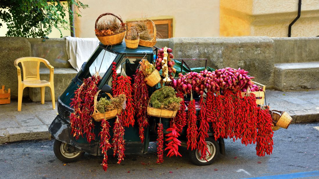 <strong>Colorful:</strong> Braids of onions and chilli peppers are everywhere in Tropea.