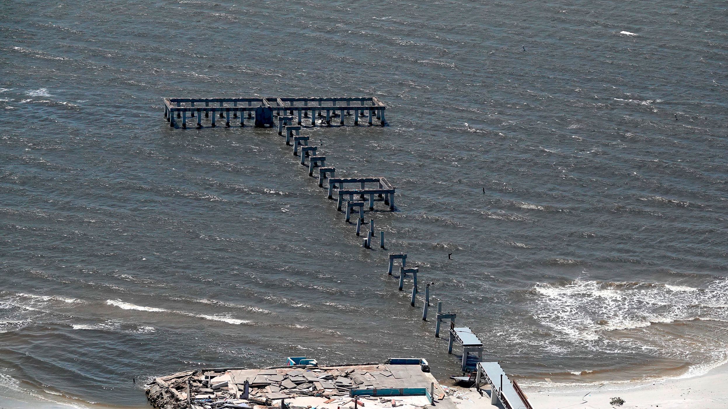 The fishing pier at Fort Myers Beach after Hurricane Ian struck the community on the Gulf of Mexico.