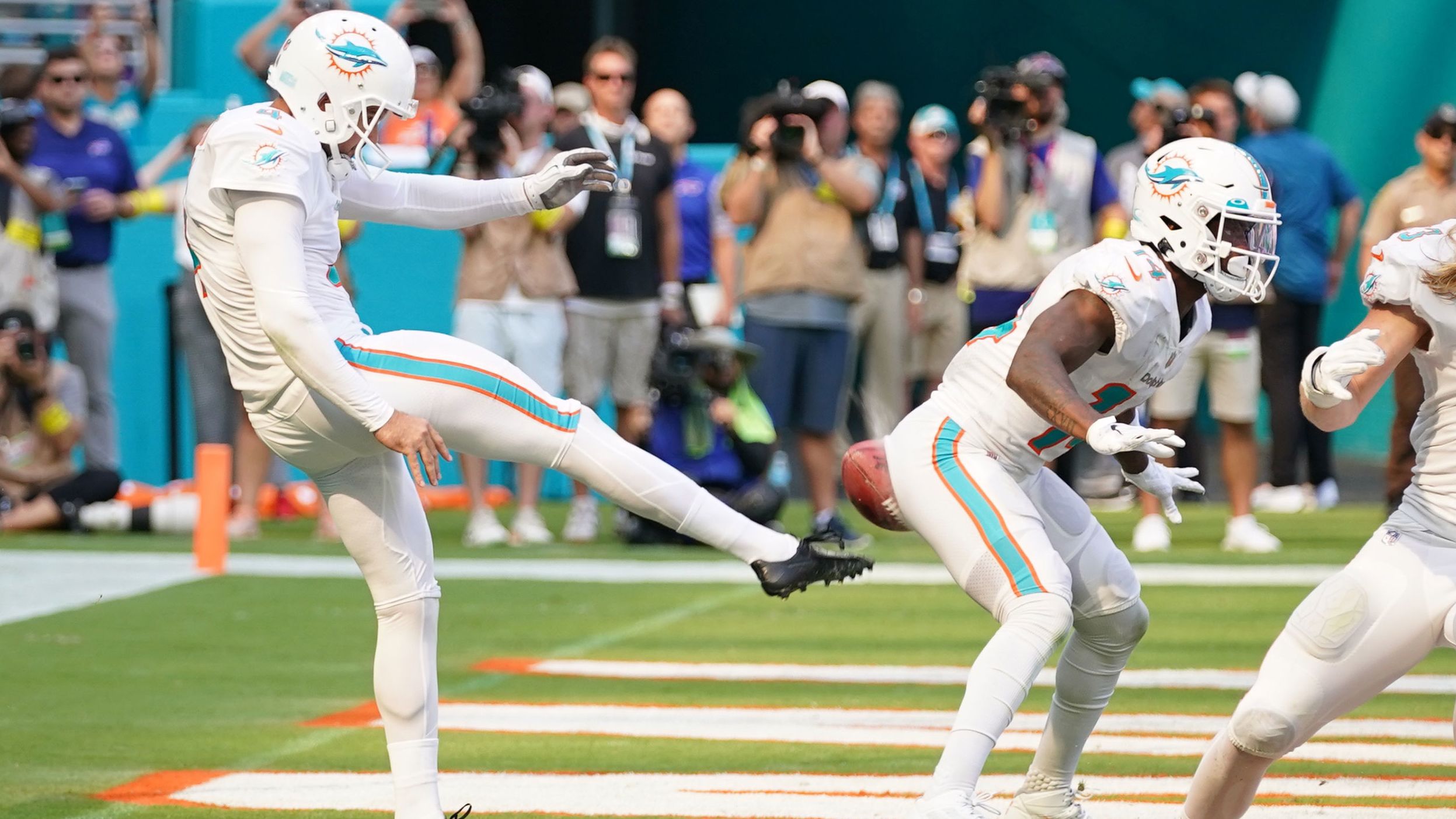 Miami's Thomas Morstead punts the ball into the backside of teammate Trent Sherfield during an NFL game against Buffalo on Sunday, September 25. The play resulted in a safety for Buffalo, but Miami went on to win 21-19. <a href="https://www.cnn.com/2022/09/12/sport/gallery/nfl-2022-season" target="_blank">See the best photos from the 2022 NFL season.</a>