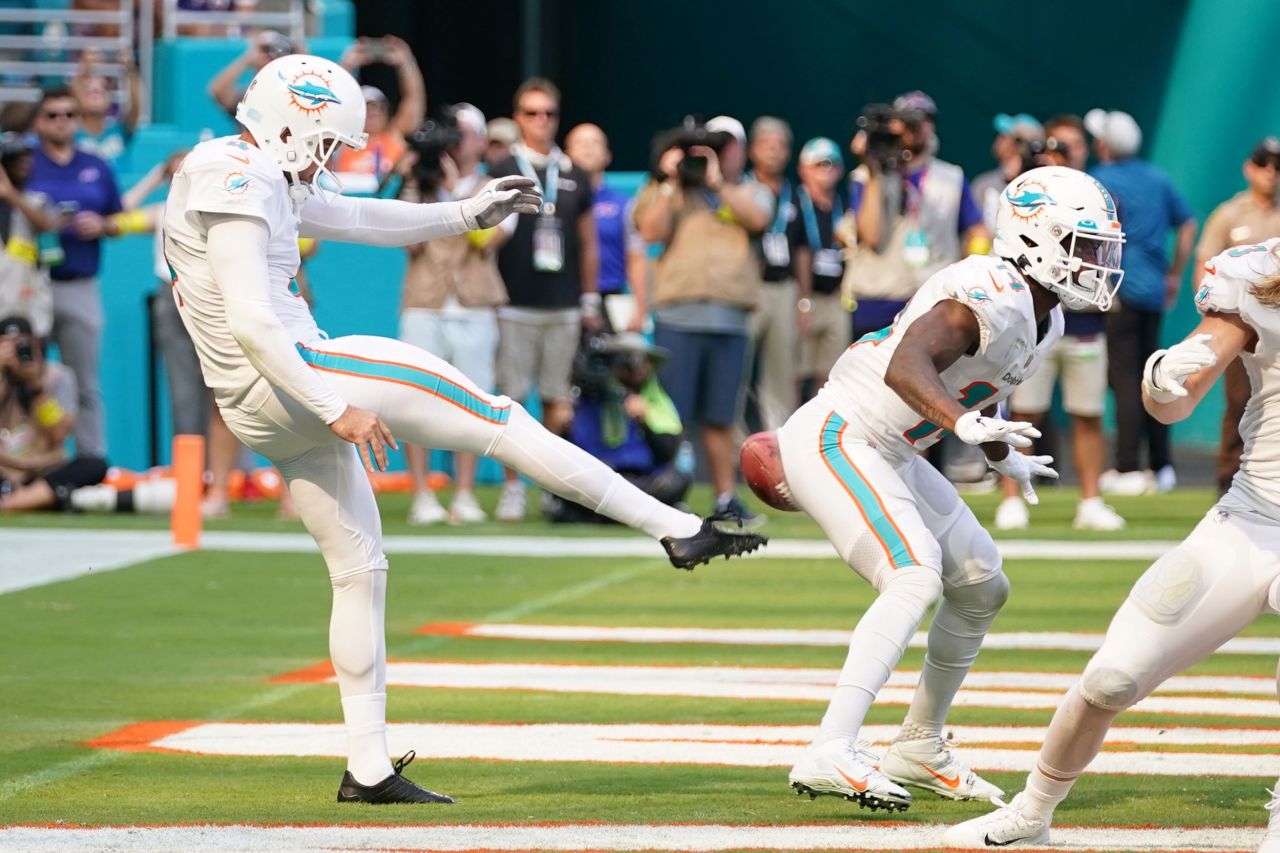 Miami's Thomas Morstead punts the ball into the backside of teammate Trent Sherfield during an NFL game against Buffalo on Sunday, September 25. The play resulted in a safety for Buffalo, but Miami went on to win 21-19. <a href="https://www.cnn.com/2022/09/12/sport/gallery/nfl-2022-season" target="_blank">See the best photos from the 2022 NFL season.</a>