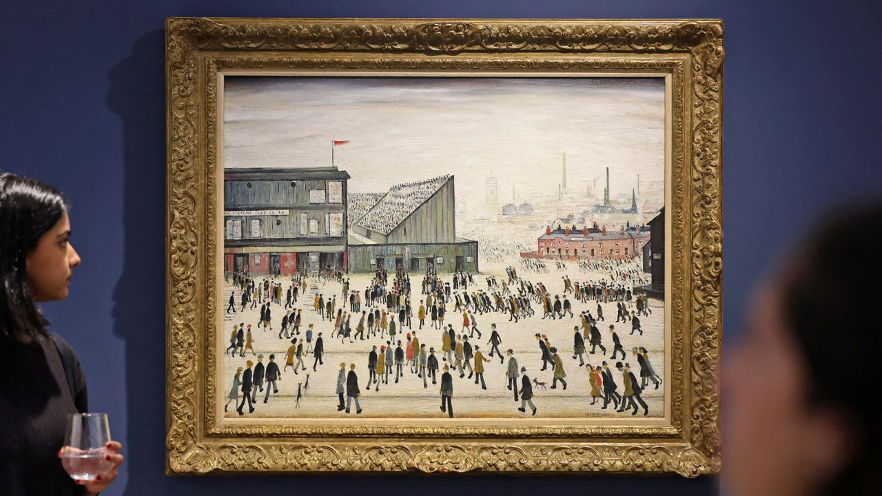 L.S. Lowry's "Going to the Match" is displayed in Dubai earlier this month.