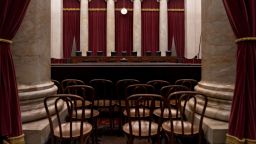 Chairs of U.S. Supreme Court justices sit behind the courtroom bench in Washington, D.C., U.S., on Tuesday, July 9, 2019. At the end of its term, the Supreme Court agreed to hear President Donald Trump's bid to end deportation protections for hundreds of thousands of young undocumented immigrants, taking up a politically explosive issue likely to be resolved in the heat of next year's election campaign. Photographer: Andrew Harrer/Bloomberg via Getty Images