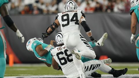 Miami Dolphins quarterback Tua Tagovailoa sacked by Cincinnati Bengals' Josh Tupou during the first half of an NFL football game on September 29 in Cincinnati.