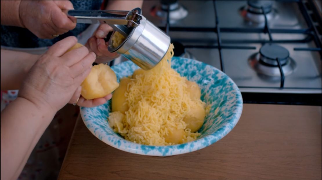 After boiling the potatoes, you can load them in batches into the canister of a potato ricer. Or use a masher as an alternate.