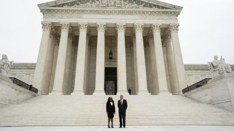 Justice Ketanji Brown Jackson and Chief Justice John Roberts stand in front of the Supreme Court on Friday.