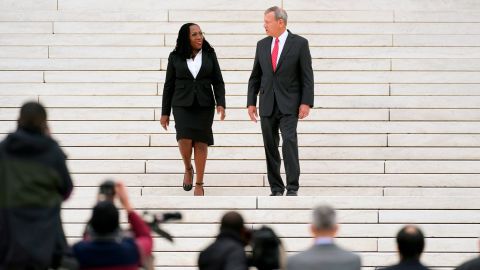 Justice Ketanji Brown Jackson walks with Chief Justice John Roberts down the front steps of the Supreme Court after her investiture ceremony Friday.