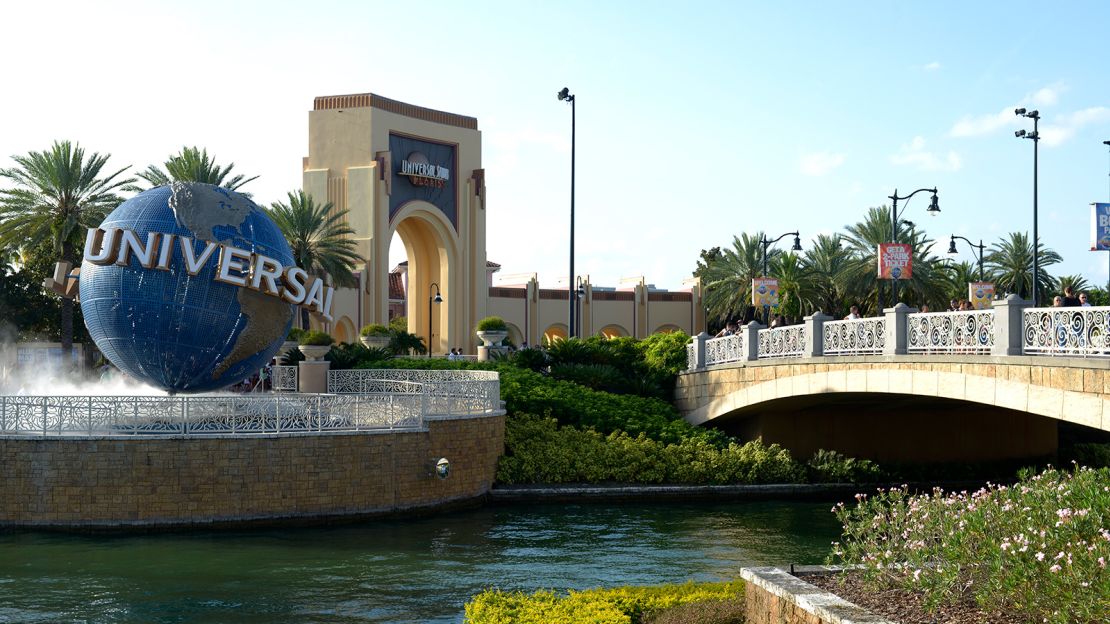 The iconic Universal globe spins outside the entrance to the Universal Studios  theme park in Orlando.