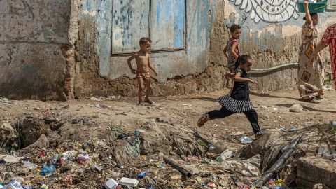 Egyptian children play on Thursday on the polluted banks of the Nile river in the Egyptian capital Cairo. Egypt will host the COP27 United Nations Climate Change Conference in November in its Red Sea resort of Sharm El Sheikh.  
