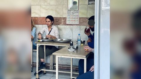 Donya Rad is seen in pictures posted on social media at a restaurant in Tehran.  The face of the man on the right was obscured in the original social media post.