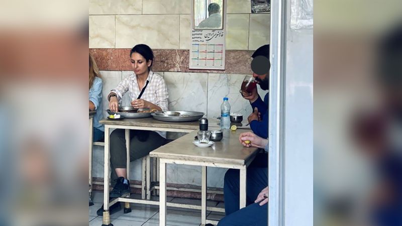 Iranian security forces arrest a woman for eating at restaurant in public without her hijab, family says