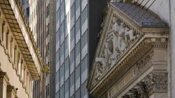 The New York Stock Exchange building, right, is seen, Tuesday, Sept. 27, 2022, in the Financial District of New York. 