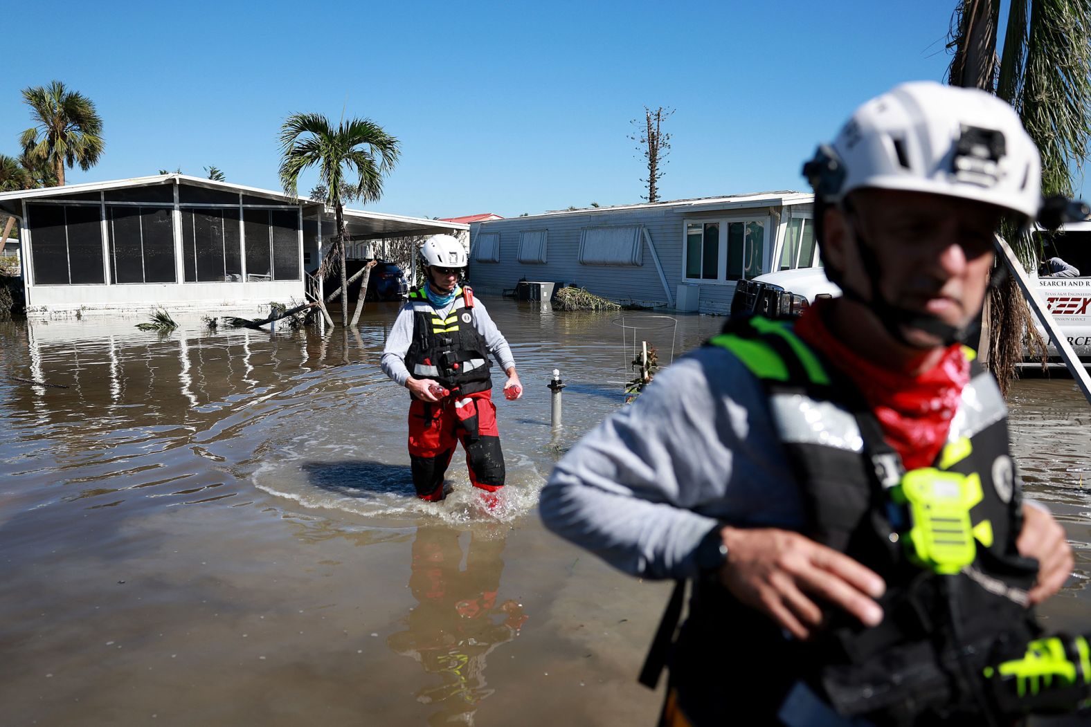 Members of the Texas A&M Task Force 1 Search and Rescue team look for anyone needing help on Friday in Fort Myers, Florida.