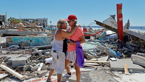 Candy Miller, left, embraces Ana Kapel, the manager of the Pier Peddler, at the site of what used to be the store on Fort Myers Beach, FL, on Friday, Sept. 30, 2022.
