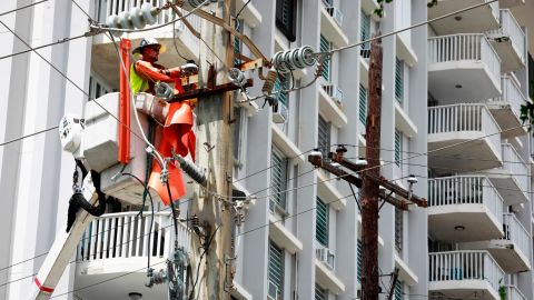 LUMA employees work to restore service on September 20, 2022 in San Juan, Puerto Rico.