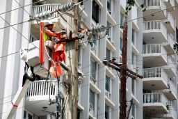 LUMA employees work to restore service on September 20, 2022 in San Juan, Puerto Rico.