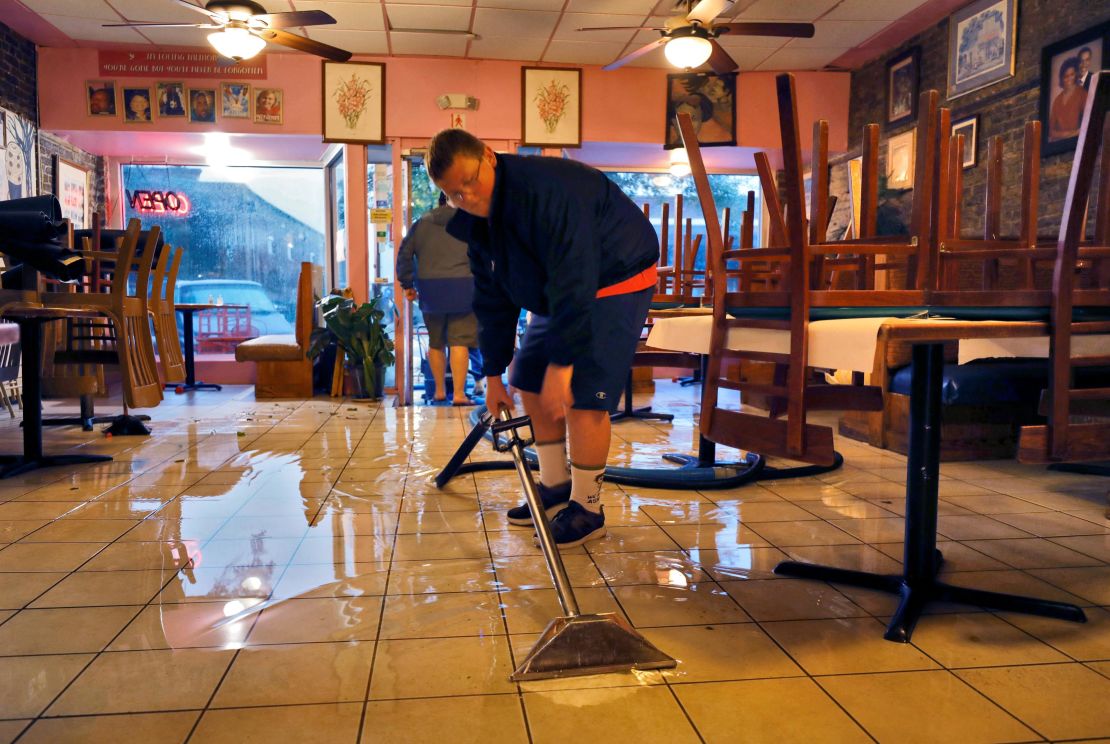 Flood waters are suctioned from inside a restaurant near where Hurricane Ian made landfall in Georgetown, South Carolina on Friday.