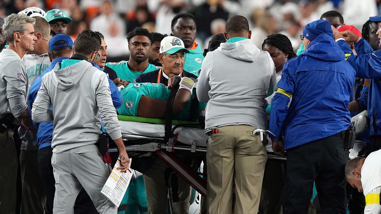 Medical staff tend to quarterback Tua Tagovailoa #1 of the Miami Dolphins as he is carted off on a stretcher after an injury during the 2nd quarter of the game against the Cincinnati Bengals at Paycor Stadium on September 29, in Cincinnati, Ohio. 