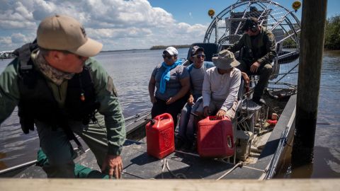 Lee County authorities evacuate people on an airboat in the wake of Hurricane Ian in Lee County, Florida, on October 1, 2022.